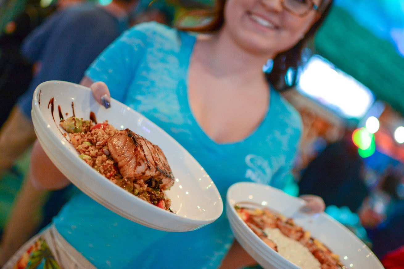 Nalu team serving colorful Pacific-inspired dishes