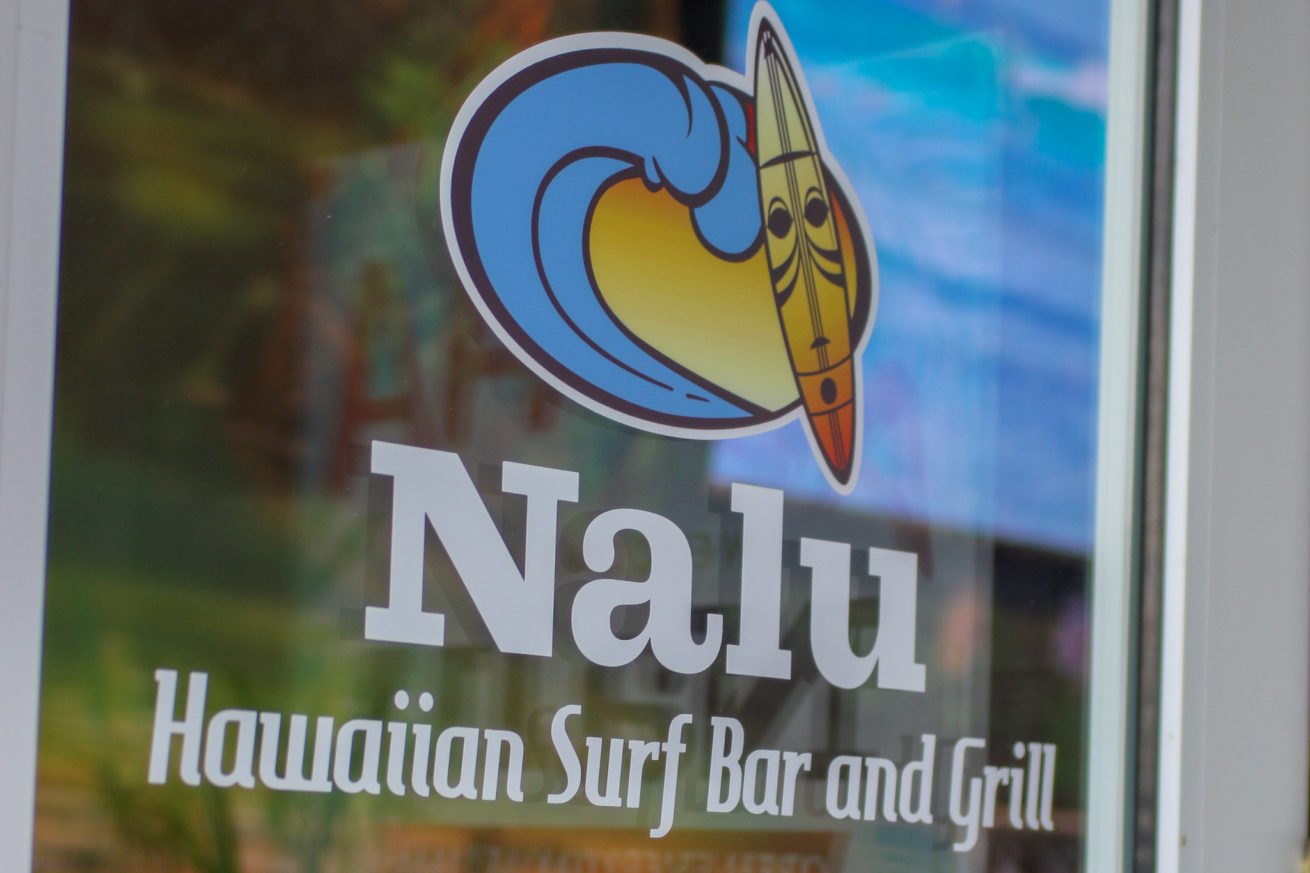 Nalu surfboard and wave logo on the restaurant window