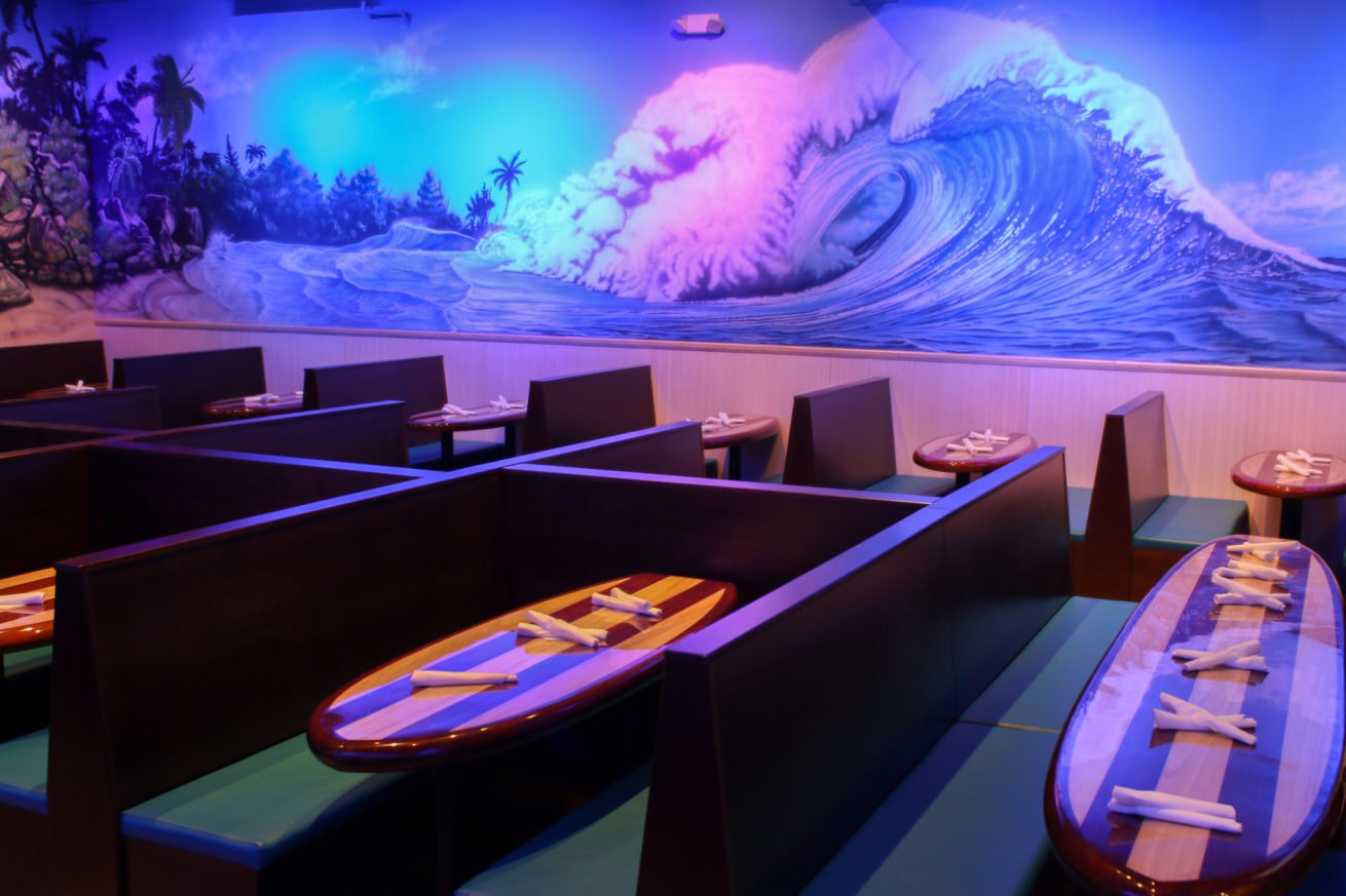 Surf mural and colorful dining booths at Nalu Rehoboth